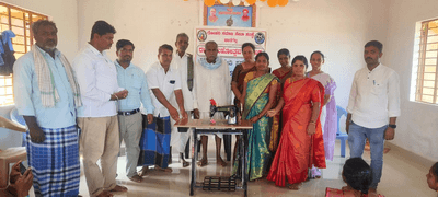 Distributed free sewing machine to a hearing impaired woman